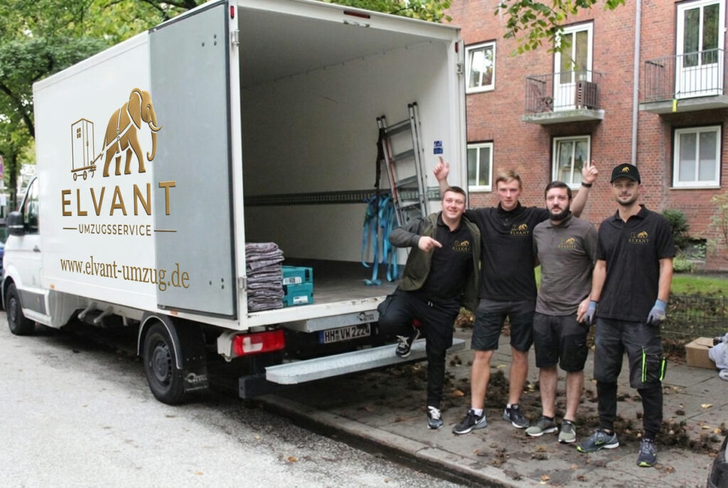 Das Elvant-Umzugsteam steht am Umzugstag vor dem geöffneten Umzugswagen.
